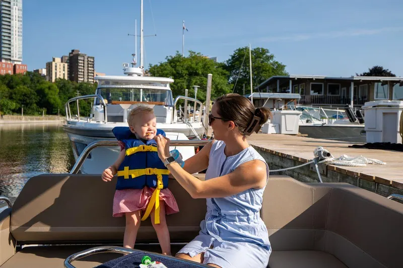 Slide: The Image of Mother and child on Nimbus Weekender 9 boat, enjoying a sunny day at the marina. - 27