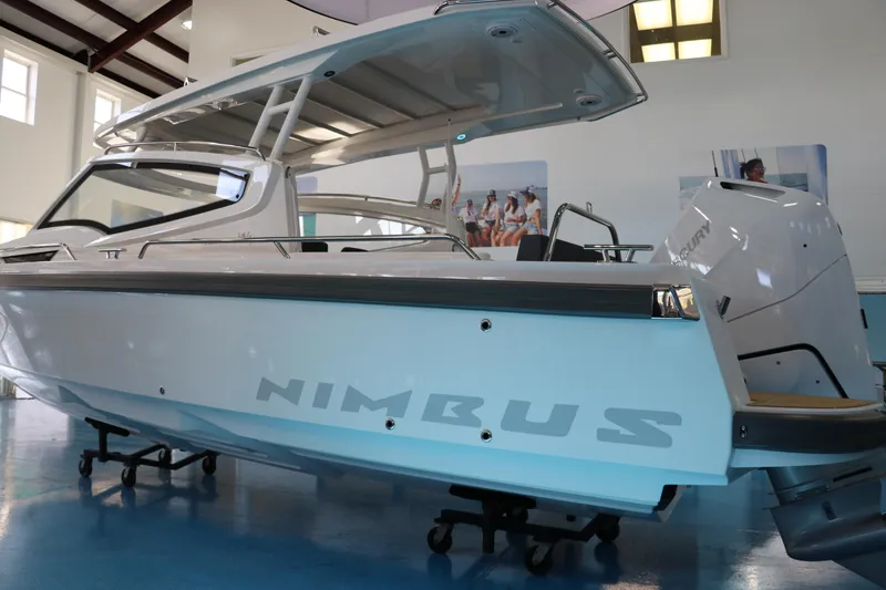 Slide: The Image of 2025 Nimbus Weekender 9 boat displayed indoors, showcasing sleek design and modern features. - 4