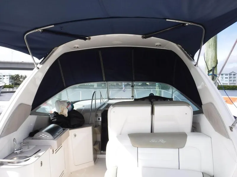 Slide: The Image of 2007 Sea Ray 310 boat interior with seating and canopy. - 11