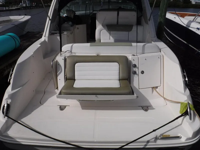 Slide: The Image of 2007 Sea Ray 310 boat interior with seating and storage compartments. - 12
