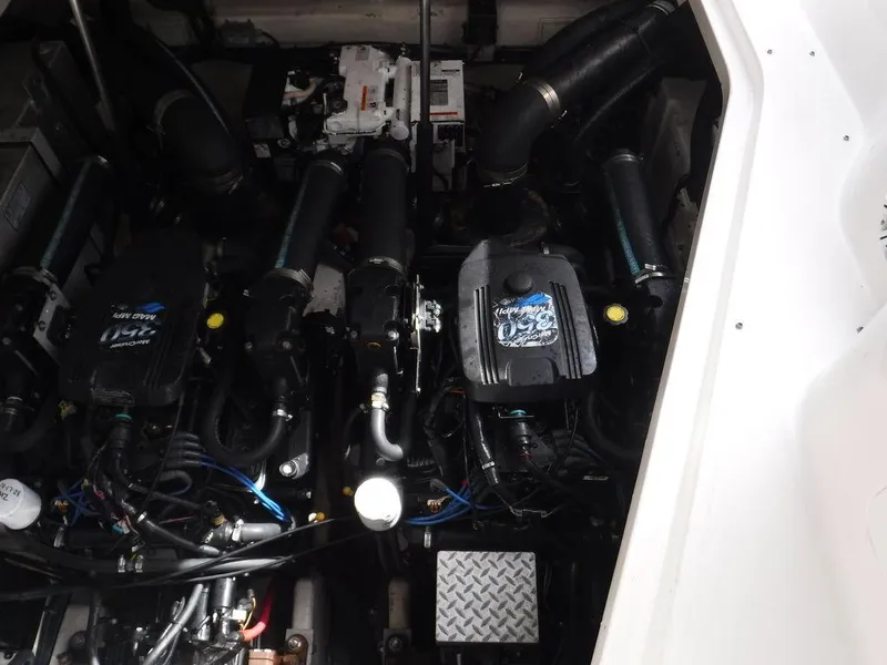Slide: The Image of Engine compartment of a 2007 Sea Ray 310 boat, showcasing dual engines and mechanical components. - 13