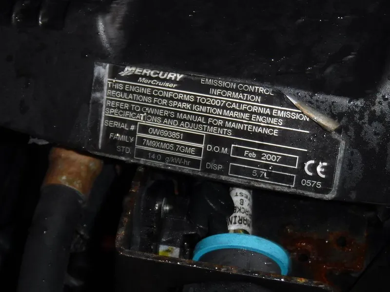 Slide: The Image of Mercury MerCruiser engine label on a 2007 Sea Ray 310, showing emission control information. - 15