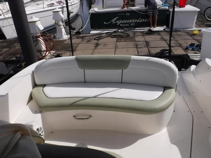 Slide: The Image of 2007 Sea Ray 310 boat seating area at a marina. - 16