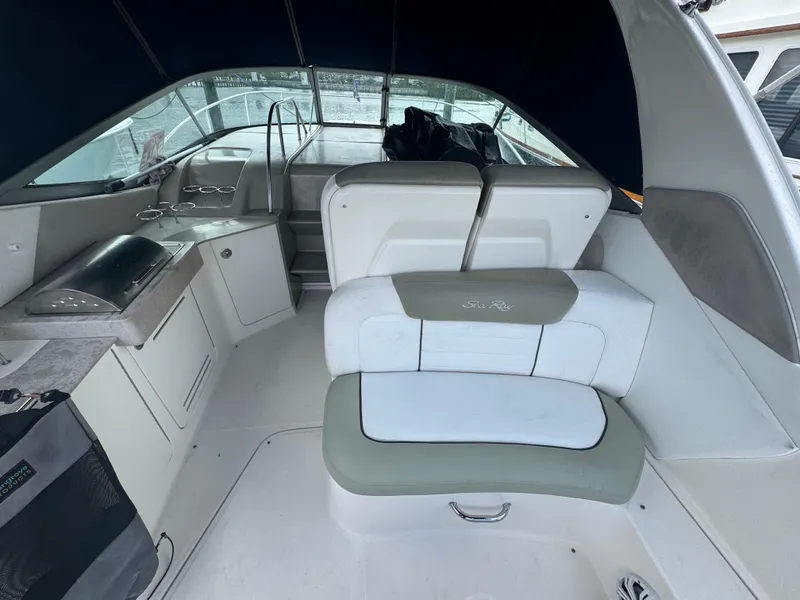 Slide: The Image of 2007 Sea Ray 310 boat interior with seating and helm area. - 18