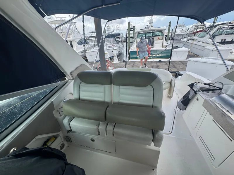 Slide: The Image of 2007 Sea Ray 310 boat interior with seating and marina view. - 20
