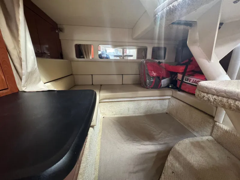 Slide: The Image of Interior cabin of 2007 Sea Ray 310 boat with seating and life jackets. - 26
