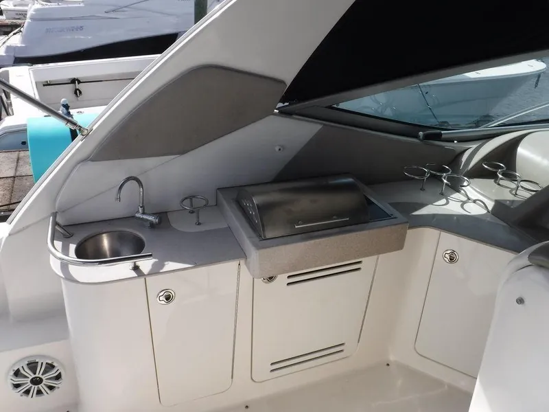 Slide: The Image of 2007 Sea Ray 310 boat interior with sink and grill station. - 3