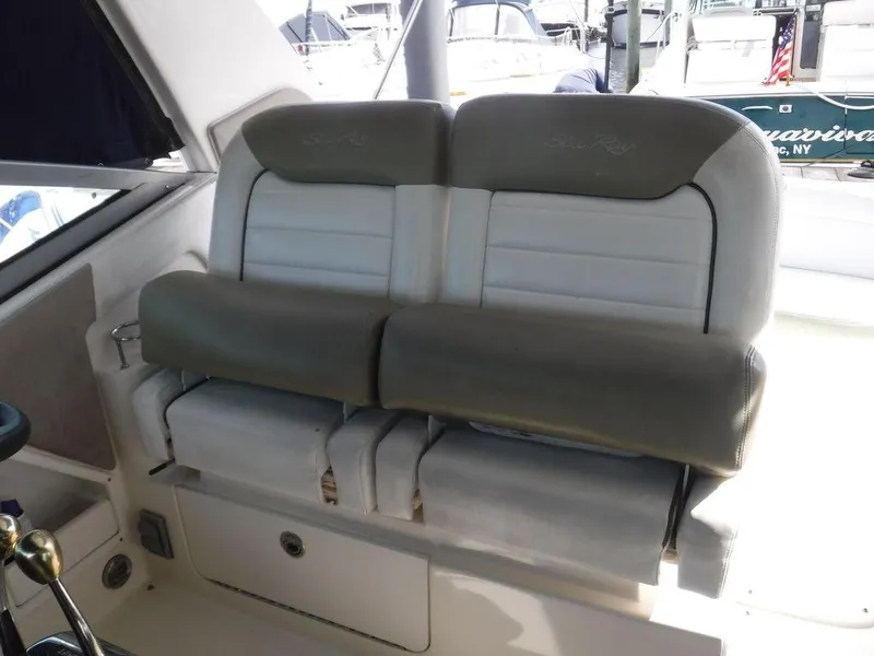 Slide: The Image of 2007 Sea Ray 310 boat interior seating with cushioned backrest. - 9