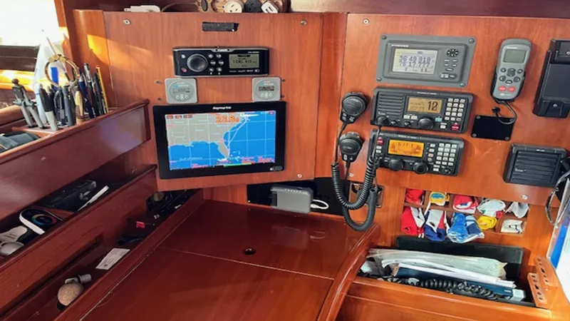 Slide: The Image of Navigation equipment on a 2005 Beneteau 57 yacht, featuring GPS and communication devices. - 11