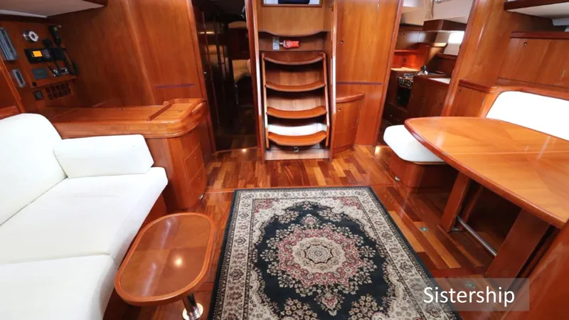 Slide: The Image of Luxurious interior of a 2005 Beneteau 57 yacht with elegant wood finish and plush seating. - 3