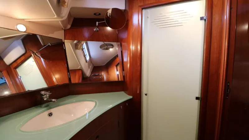 Slide: The Image of Luxurious bathroom interior of 2005 Beneteau 57 yacht with modern sink and mirror. - 9