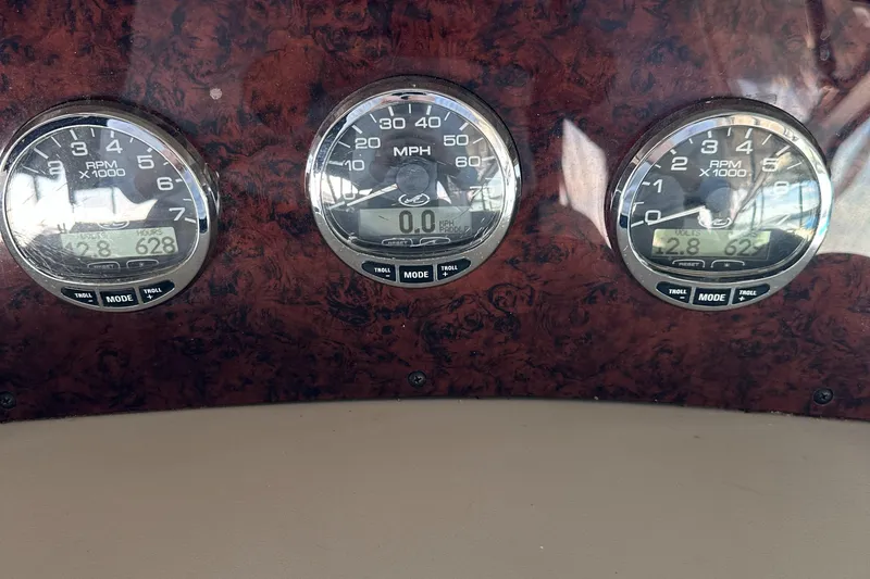 Slide: The Image of Dashboard gauges of a 2008 Sea Ray 340 Sundancer boat. - 10