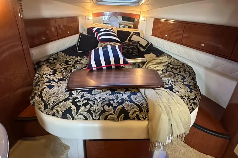 Slide: The Image of Luxurious cabin interior of 2008 Sea Ray 340 Sundancer with elegant bedding and cushions. - 16