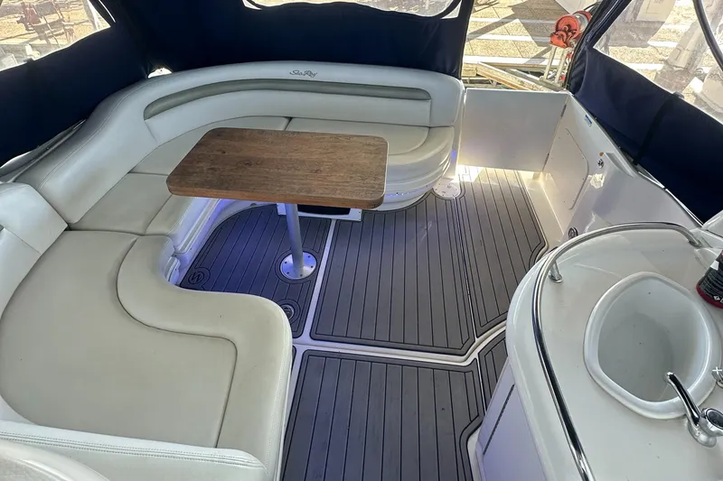 Slide: The Image of 2008 Sea Ray 340 Sundancer interior with seating, table, and sink. - 23