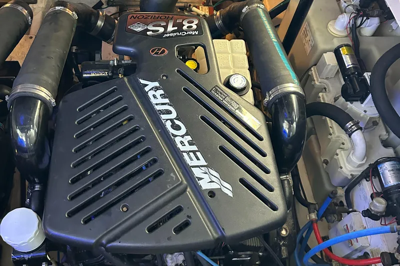 Slide: The Image of Engine of a 2008 Sea Ray 340 Sundancer boat, featuring a Mercury 8.1 Horizon motor. - 26