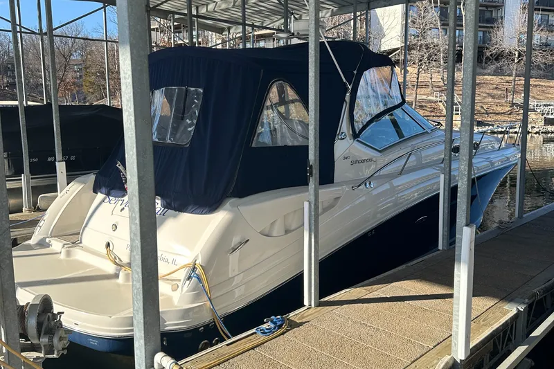 Slide: The Image of 2008 Sea Ray 340 Sundancer docked under a covered marina. - 4
