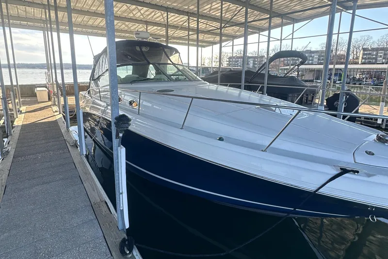 Slide: The Image of 2008 Sea Ray 340 Sundancer docked in a marina, side view. - 5