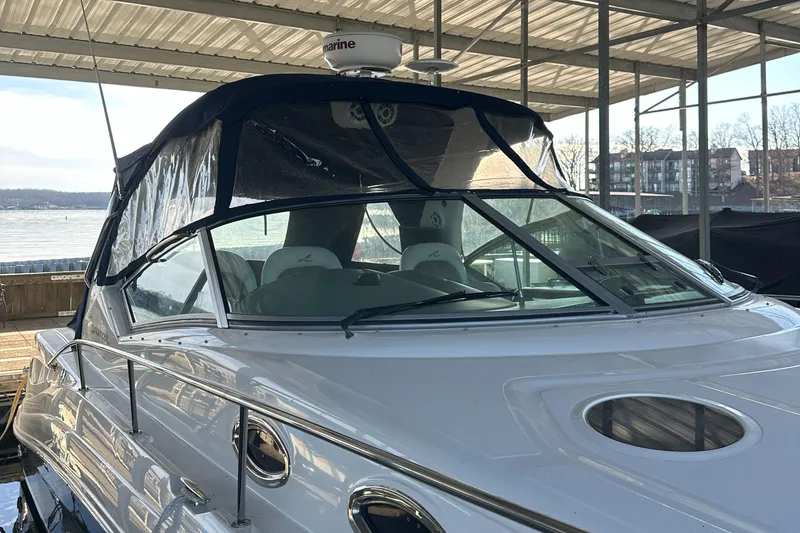 Slide: The Image of 2008 Sea Ray 340 Sundancer docked under a covered marina. - 6