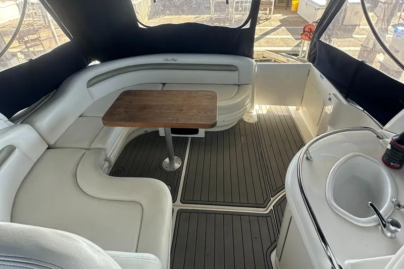 Slide: The Image of 2008 Sea Ray 340 Sundancer interior with seating, table, and sink. - 7