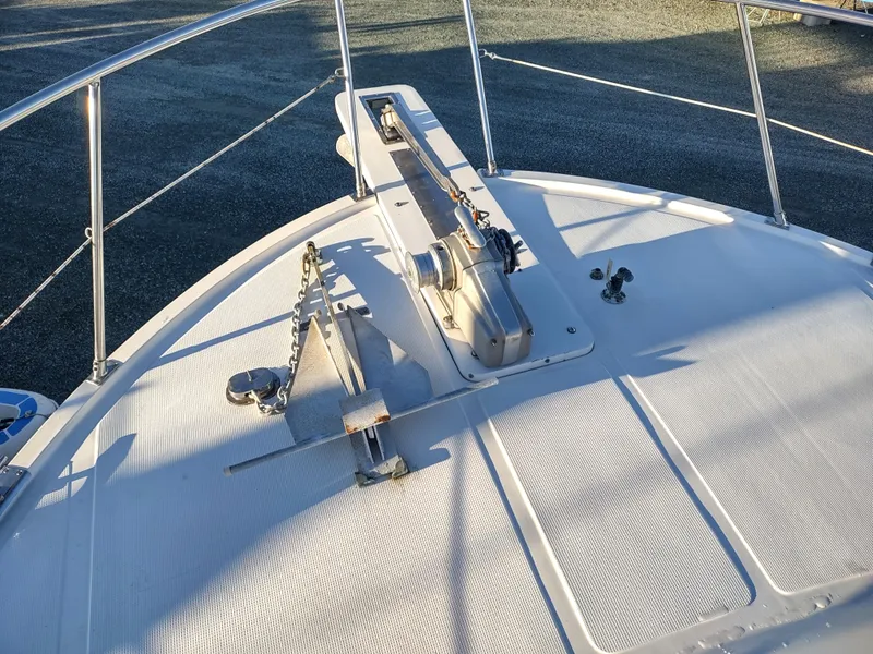 Slide: The Image of 1986 Nova 48 Cockpit Motor Yacht deck with anchor and winch system. - 13