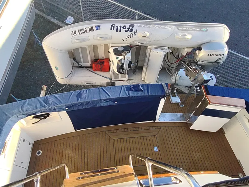 Slide: The Image of 1986 Nova 48 Cockpit Motor Yacht with inflatable boat and Honda motor. - 15