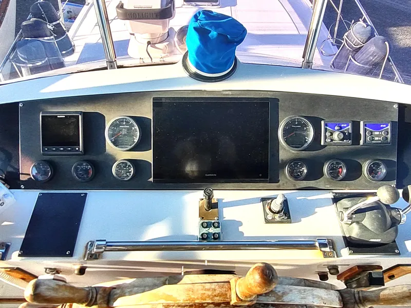 Slide: The Image of Cockpit dashboard of a 1986 Nova 48 Cockpit Motor Yacht with navigation instruments. - 32