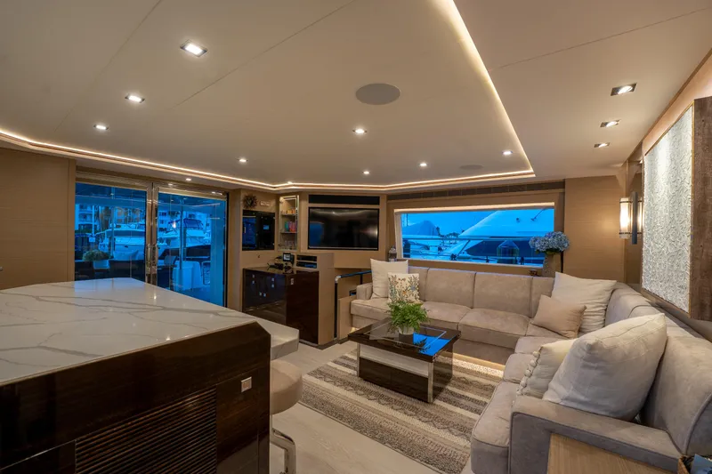 Slide: The Image of Luxurious interior of 2020 Horizon PC60 yacht with modern furnishings and ambient lighting. - 10
