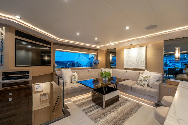 Slide: The Image of Luxurious interior of 2020 Horizon PC60 yacht with modern decor and ambient lighting. - 13