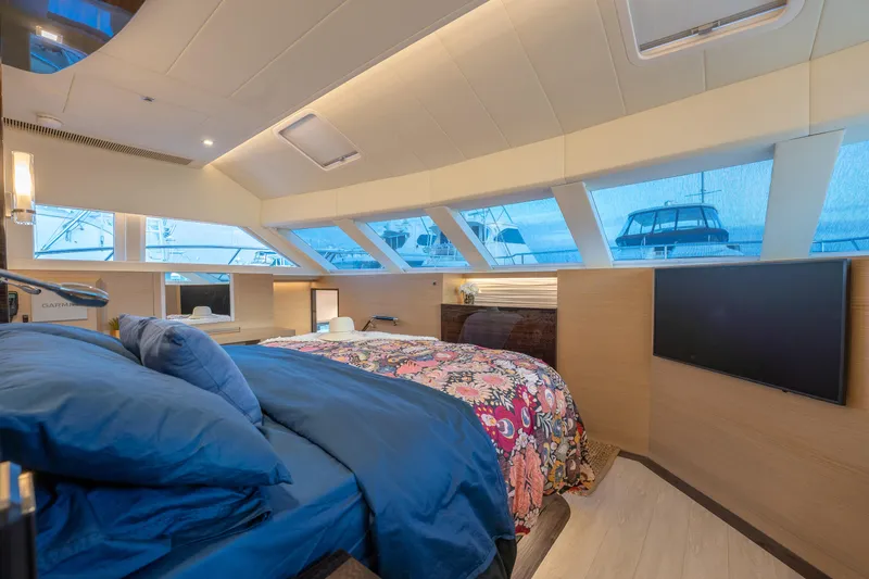 Slide: The Image of Luxurious Horizon PC60 yacht bedroom with panoramic windows and modern decor, 2020 model. - 17