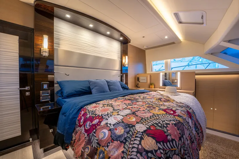 Slide: The Image of Luxurious bedroom interior on 2020 Horizon PC60 yacht with floral bedding and modern lighting. - 18