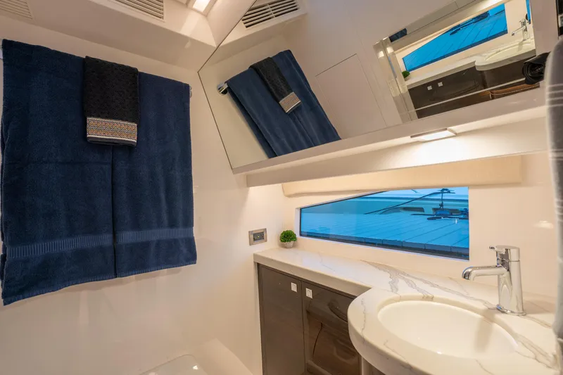 Slide: The Image of Luxurious bathroom in 2020 Horizon PC60 yacht with modern fixtures and elegant design. - 21