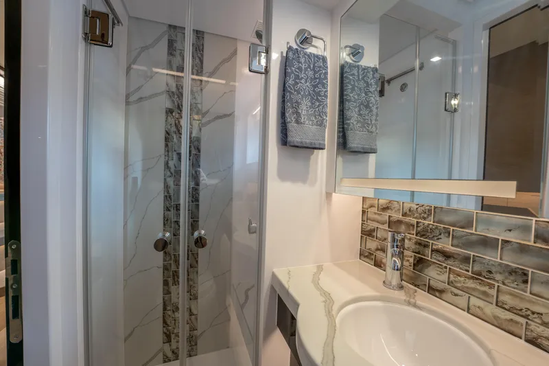 Slide: The Image of Modern bathroom with glass shower, marble tiles, and elegant sink in Horizon PC60, 2020 model. - 32