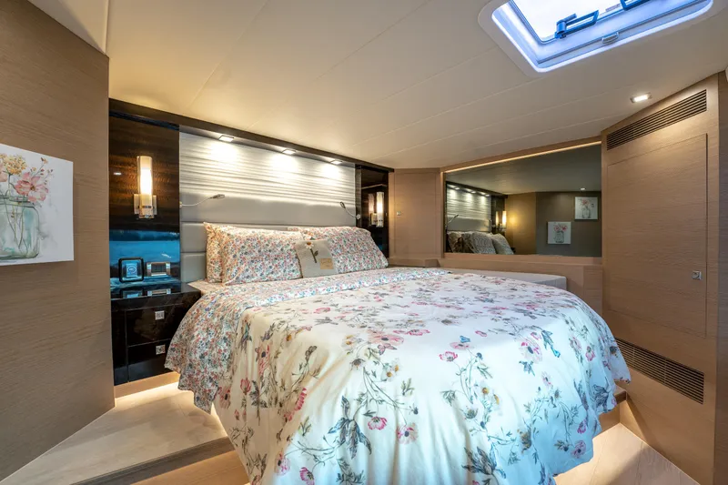 Slide: The Image of Luxurious bedroom interior on 2020 Horizon PC60 yacht with floral bedding and modern lighting. - 34