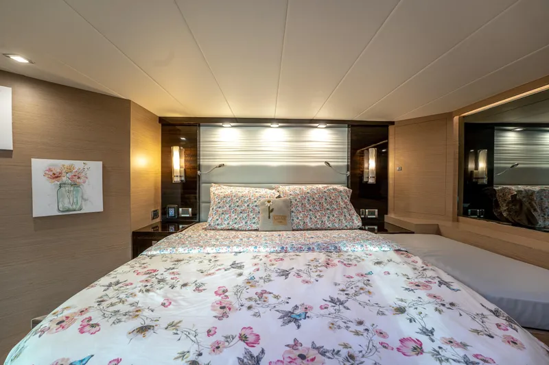 Slide: The Image of Luxurious bedroom interior on 2020 Horizon PC60 yacht with floral bedding and elegant lighting. - 35
