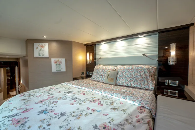 Slide: The Image of Luxurious bedroom interior on 2020 Horizon PC60 yacht with floral bedding and modern lighting. - 36