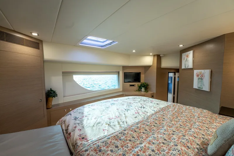 Slide: The Image of Luxurious bedroom interior of 2020 Horizon PC60 yacht with floral bedding and ocean view. - 37