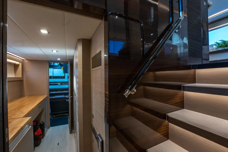 Slide: The Image of Luxurious interior of 2020 Horizon PC60 yacht with modern staircase and sleek design. - 38