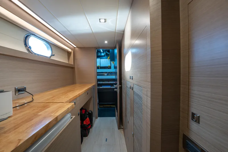 Slide: The Image of Modern interior of 2020 Horizon PC60 yacht with wooden cabinetry and porthole window. - 39