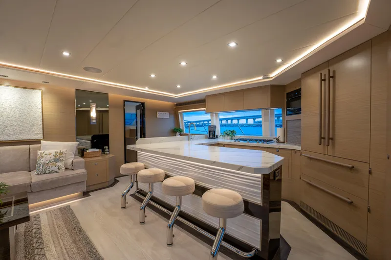 Slide: The Image of Luxurious interior of 2020 Horizon PC60 yacht with modern kitchen and seating area. - 4
