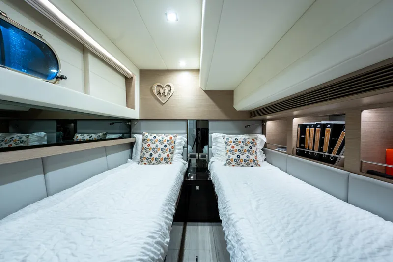 Slide: The Image of Luxurious twin cabin in 2020 Horizon PC60 yacht with modern decor and cozy bedding. - 43