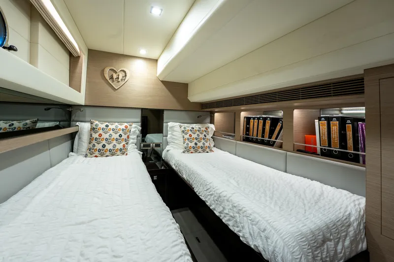 Slide: The Image of Luxurious twin cabin in 2020 Horizon PC60 yacht with modern decor and cozy bedding. - 44