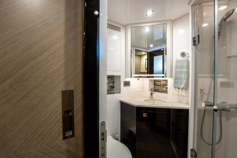 Slide: The Image of Luxurious bathroom in 2020 Horizon PC60 yacht with modern fixtures and elegant design. - 46
