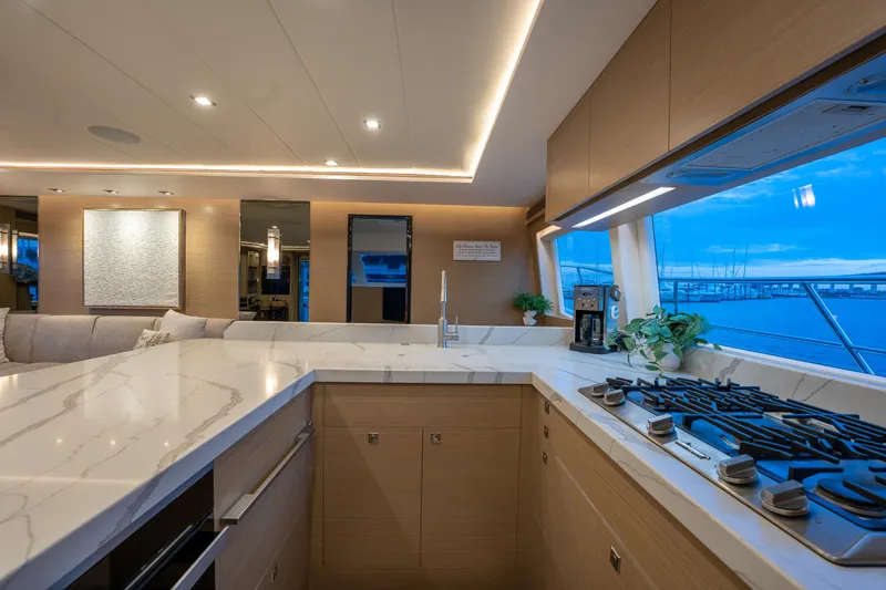 Slide: The Image of Luxurious kitchen interior on 2020 Horizon PC60 yacht with modern design and ocean view. - 6