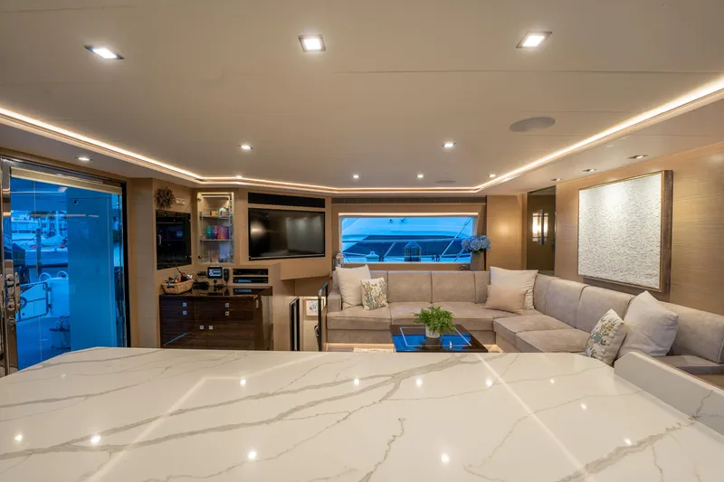 Slide: The Image of Luxurious interior of 2020 Horizon PC60 yacht with modern decor and spacious seating area. - 8