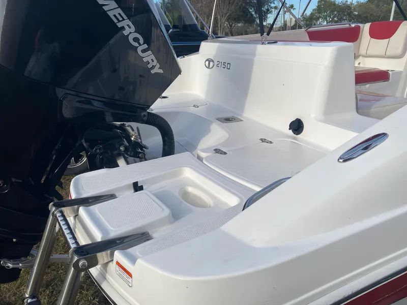 Slide: The Image of 2022 Tahoe 2150 boat with Mercury engine, featuring a swim platform and ladder. - 7