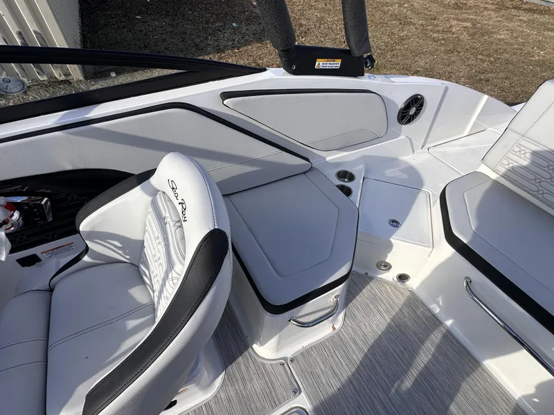 Slide: The Image of 2024 Sea Ray SPX 210 OB boat interior with white seating and modern design. - 5