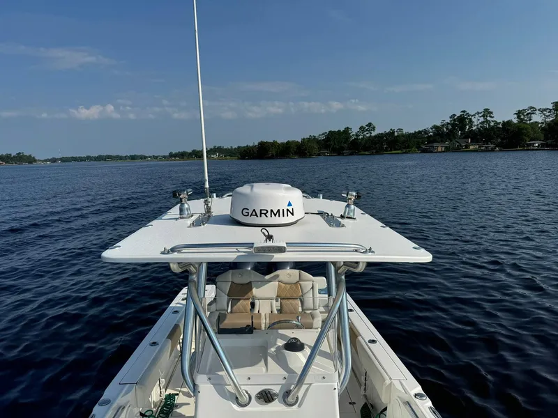 Slide: The Image of Edgewater 245CC boat on water, featuring Garmin equipment, 2018 model. - 19