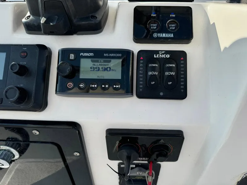 Slide: The Image of Control panel of a 2018 Edgewater 245CC boat with Yamaha and Fusion systems. - 30