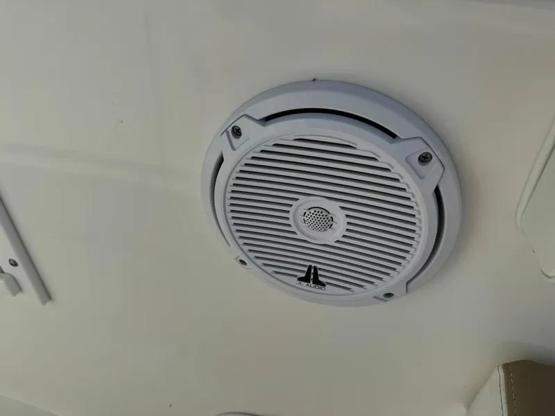 Slide: The Image of Boat speaker on 2018 Edgewater 245CC, mounted on white surface. - 33