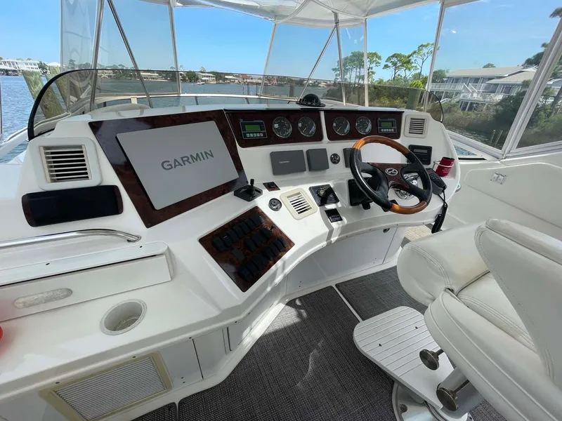 Slide: The Image of 2003 Sea Ray 560 Sedan Bridge helm with Garmin navigation system. - 10